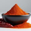 Freshly ground unadulterated Kashmiri chilli powder in a bowl displaying natural red colour